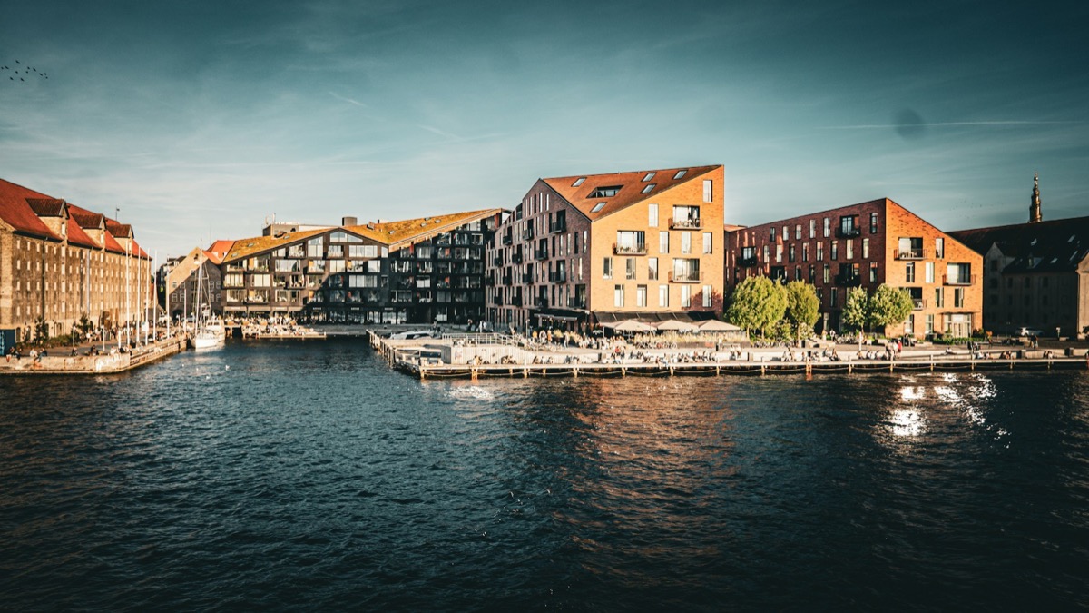 Copenhagen waterfront with modern brick buildings and canal